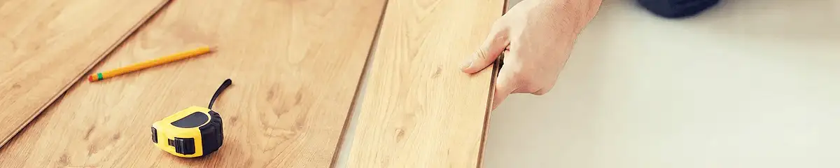 A professional installing wood flooring in Henderson, NV