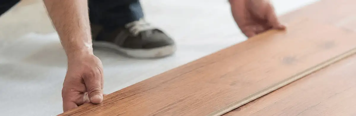 A professional installing laminate flooring in Henderson, NV