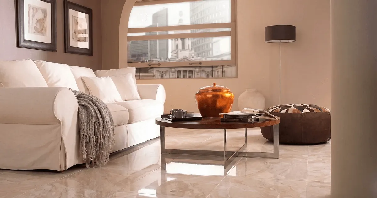 Modern living room with professionally installed marble flooring, a beige sofa, coffee table in Henderson, NV