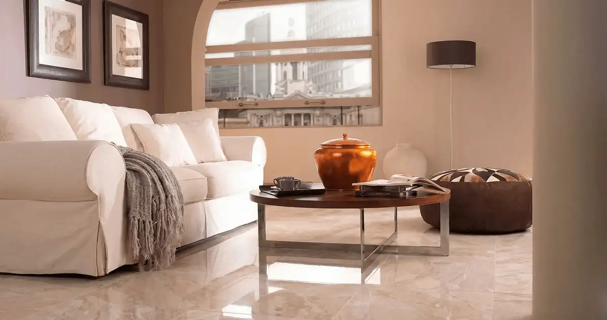Modern living room with professionally installed marble flooring, a beige sofa, coffee table in Henderson, NV