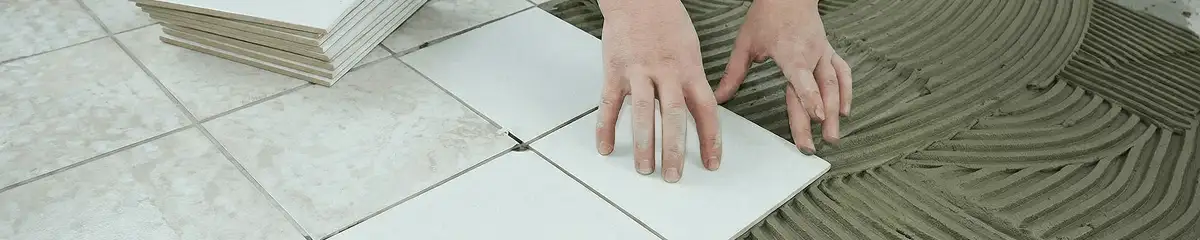 Professional installing white tile floors in Henderson, NV