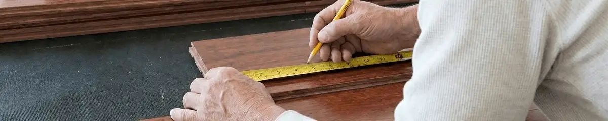 A professional installing wood flooring in Henderson, NV