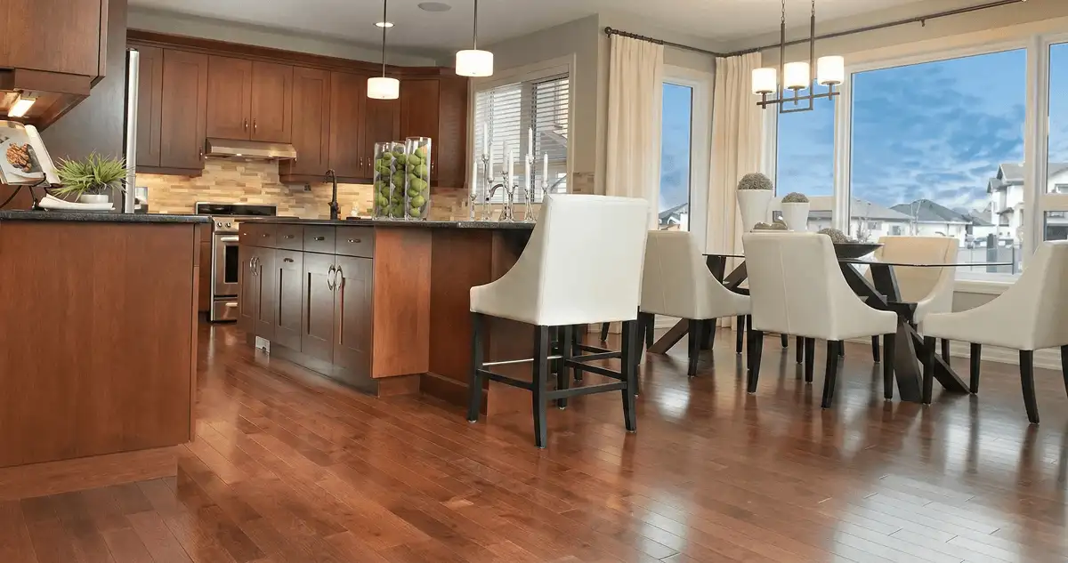 A modern kitchen with professionally installed wood flooring in Henderson, NV